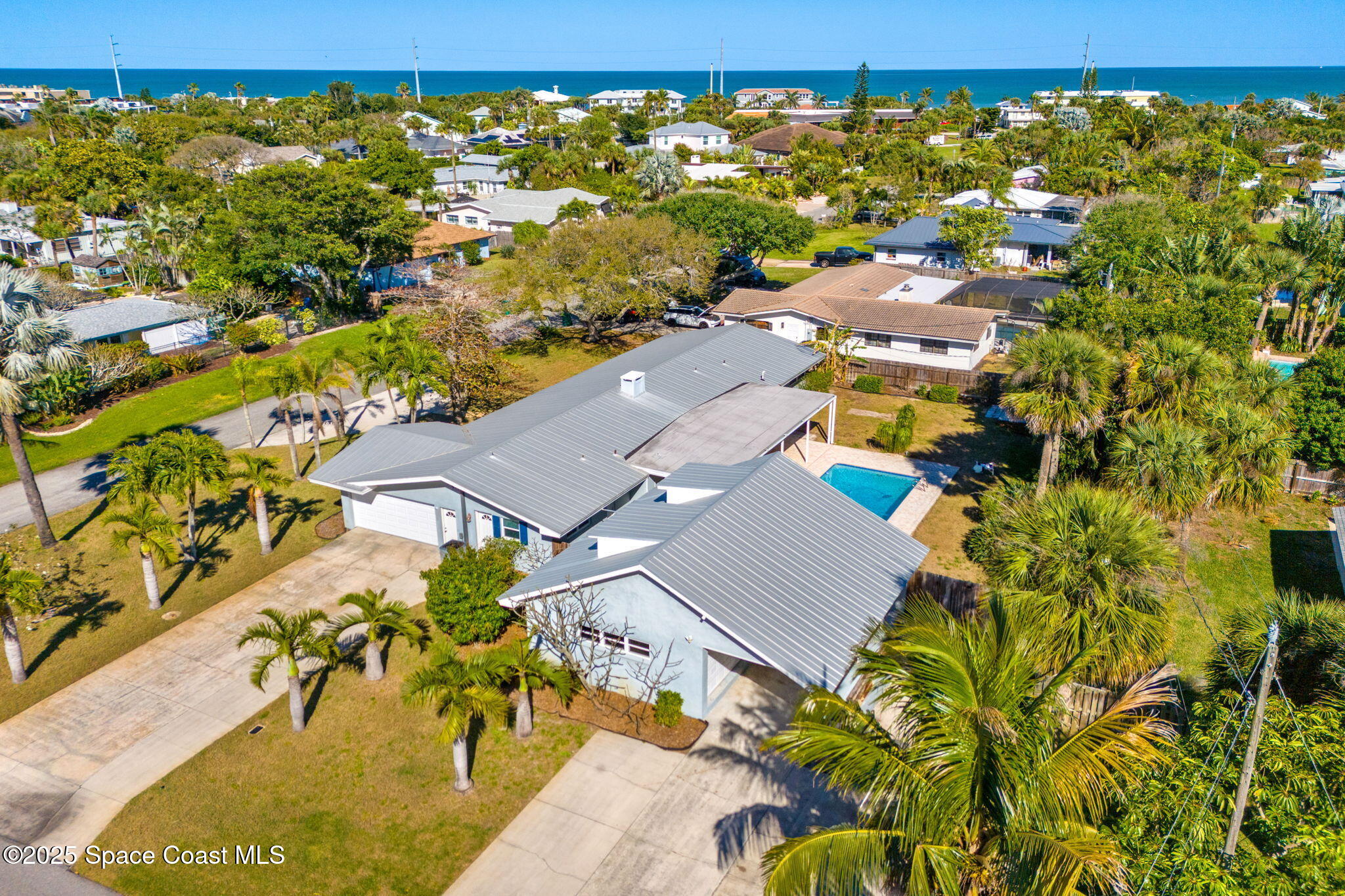 157 Cocoa Avenue Indialantic, FL 32903 - Photo 31 of 36 an aerial view of residential houses with outdoor space