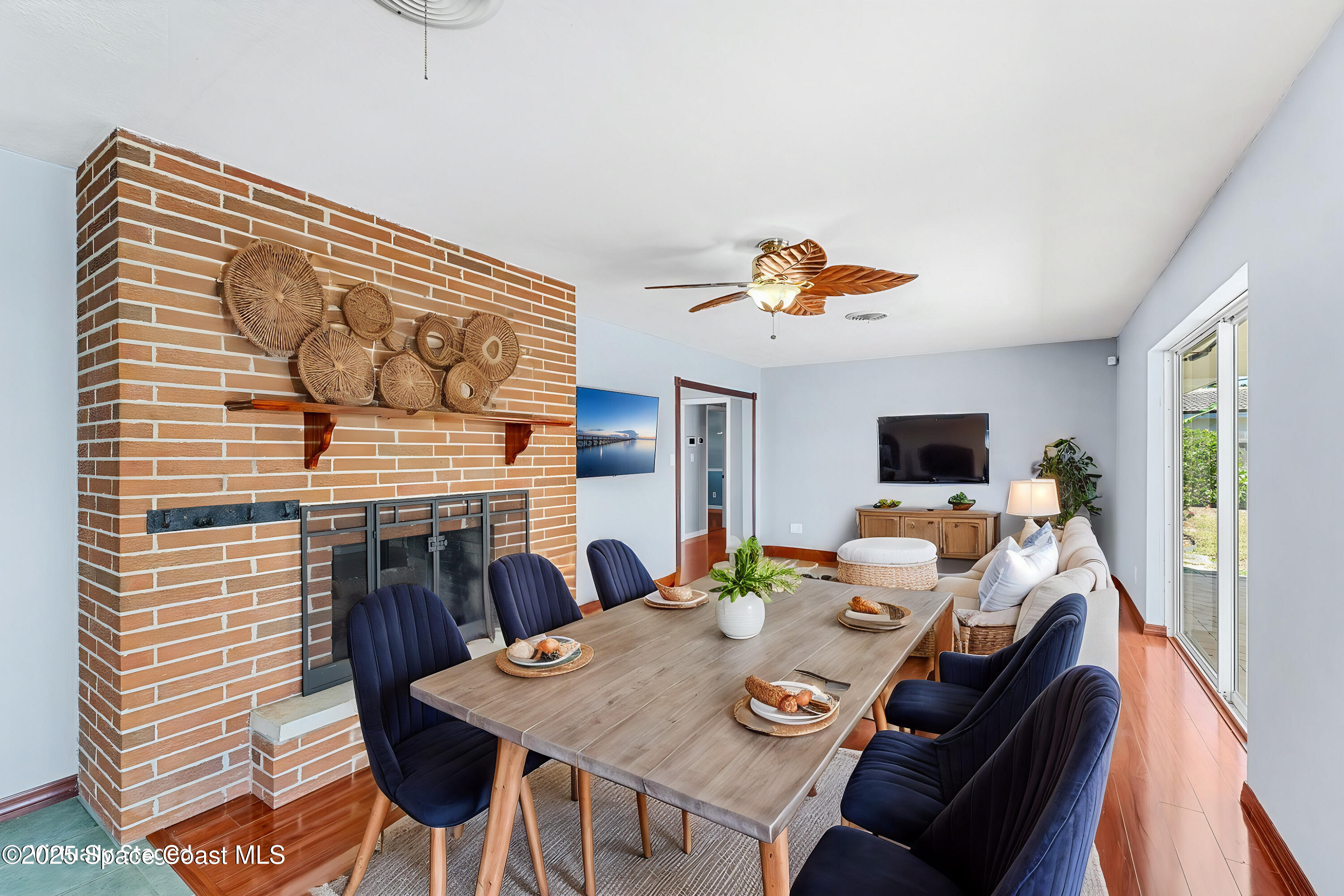 157 Cocoa Avenue Indialantic, FL 32903 - Photo 8 of 36 a living room with furniture and a fireplace