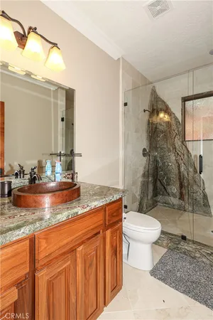 a view of a livingroom with furniture and staircase