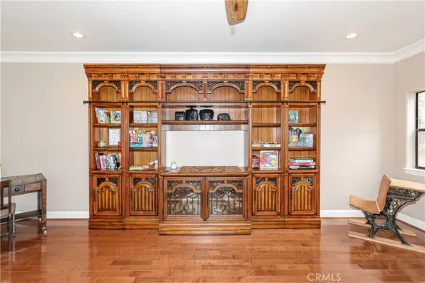 a view of an empty room with a fireplace and a window
