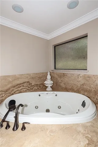 a view of a house with a wooden deck and a yard