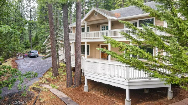 a front view of a house with yard
