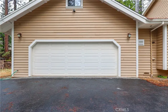 a view of staircase with wooden floor and white walls