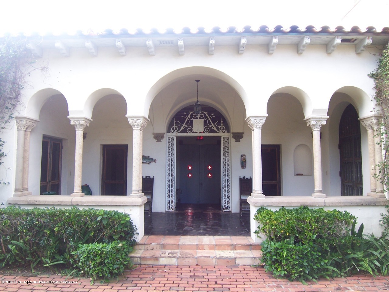 79 Middle Road Palm Beach, FL 33480 - Photo 12 of 24 a front view of a house with garden