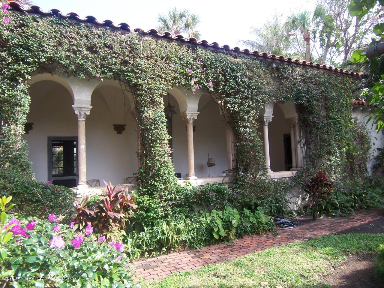 79 Middle Road Palm Beach, FL 33480 - Photo 14 of 24 a view of a house with a lot of flower plants
