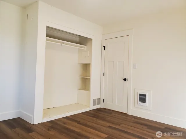 a view of a small space with wooden floor