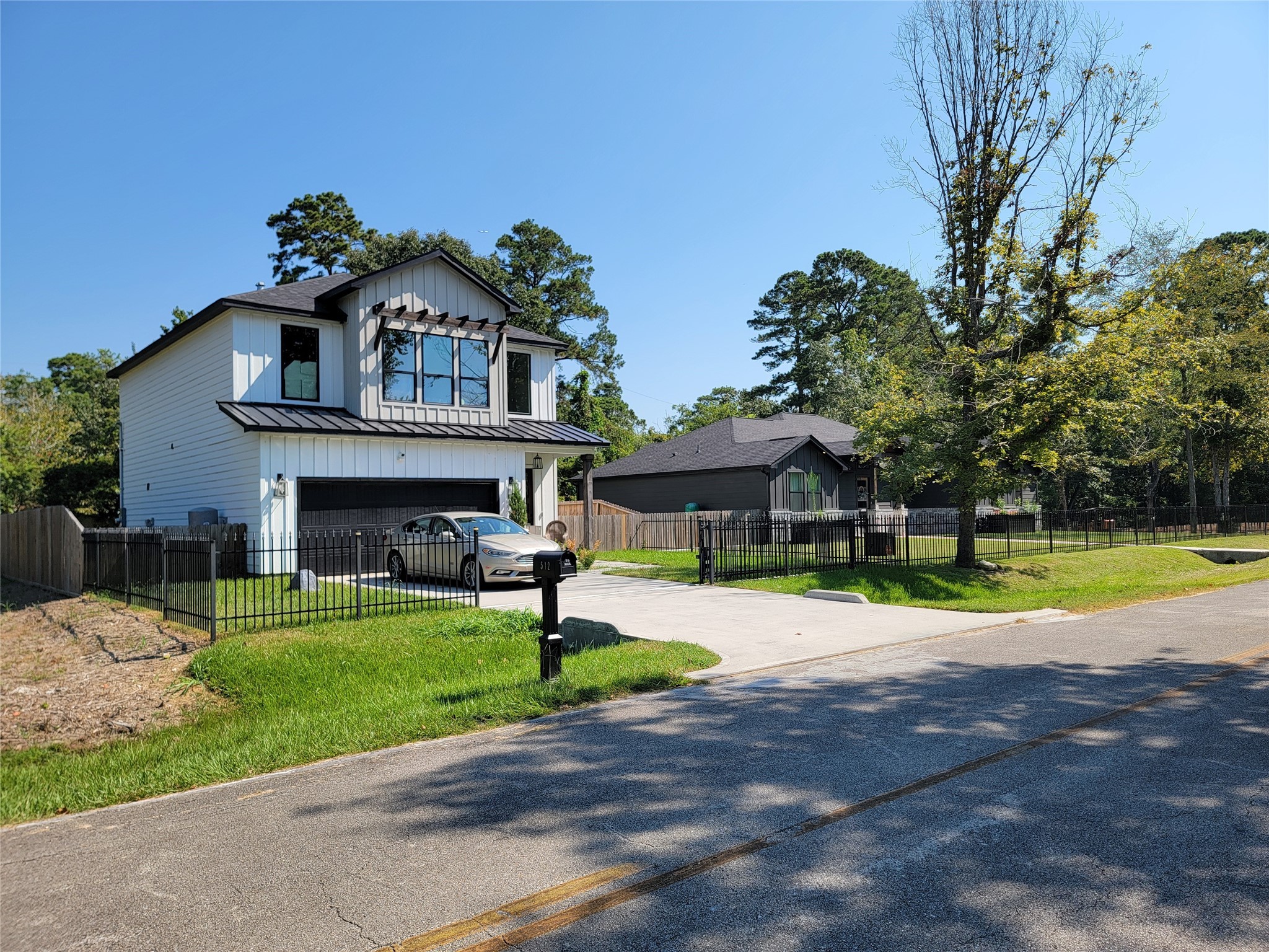 0 Springwater Drive Huffman, TX 77336 - Photo 5 of 17 a front view of a house with a yard