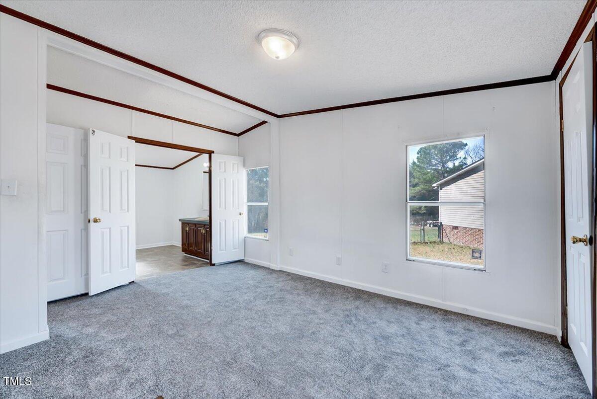 56 Jefferson Lane Cameron, NC 28326 - Photo 13 of 38 an empty room with windows and closet