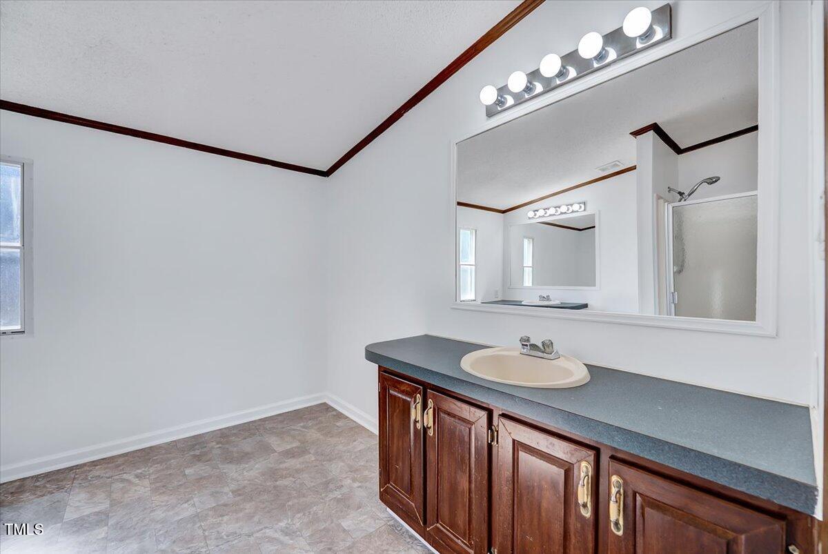 56 Jefferson Lane Cameron, NC 28326 - Photo 14 of 38 a bathroom with a sink vanity and a mirror