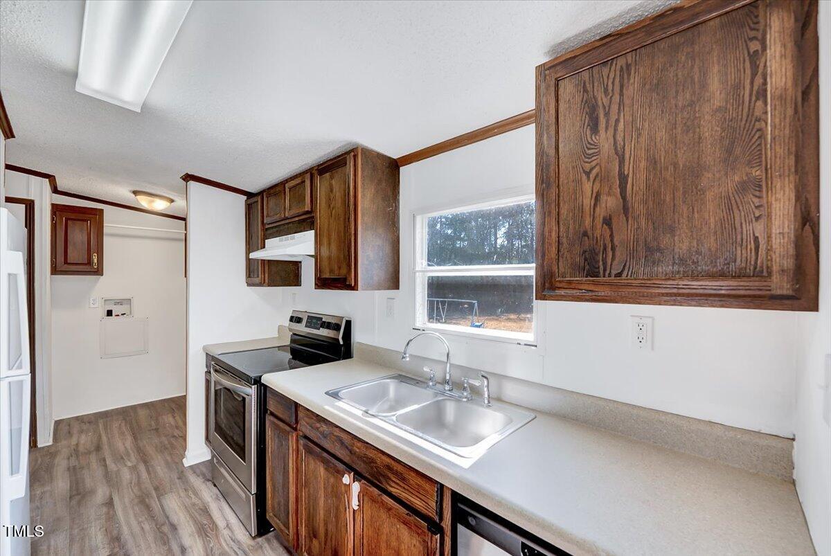 56 Jefferson Lane Cameron, NC 28326 - Photo 17 of 38 a kitchen with a sink stove and cabinets