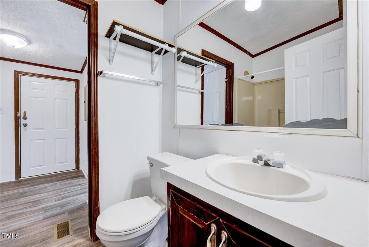 56 Jefferson Lane Cameron, NC 28326 - Photo 23 of 38 a bathroom with a sink toilet and shower