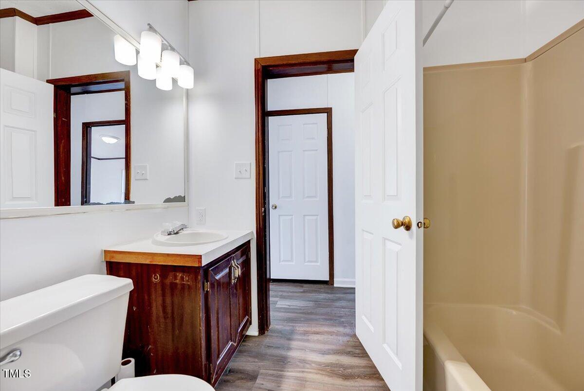 56 Jefferson Lane Cameron, NC 28326 - Photo 24 of 38 a bathroom with a sink a toilet and mirror