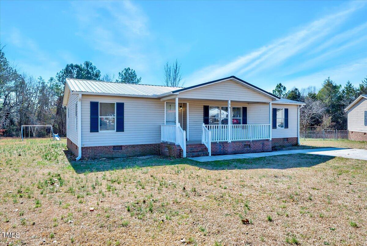 56 Jefferson Lane Cameron, NC 28326 - Photo 2 of 38 a view of a house with a yard
