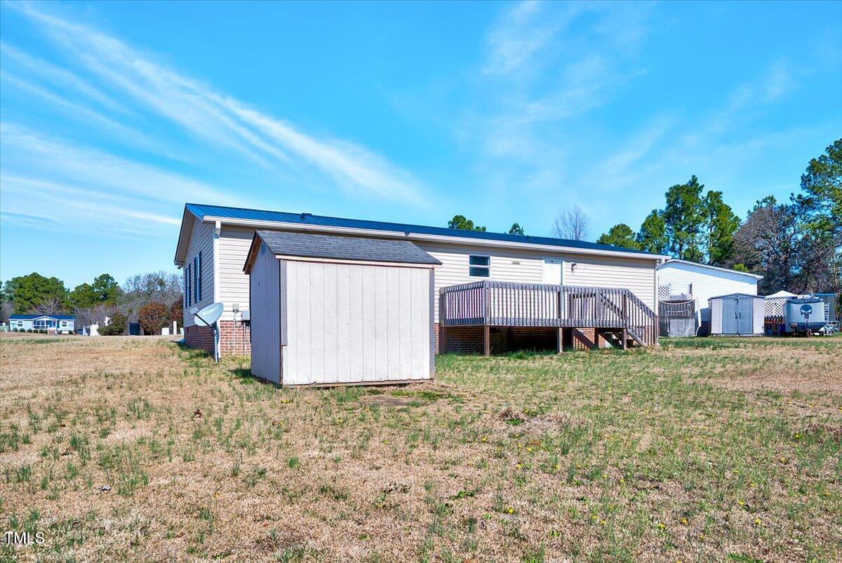 56 Jefferson Lane Cameron, NC 28326 - Photo 32 of 38 a view of a house with a yard