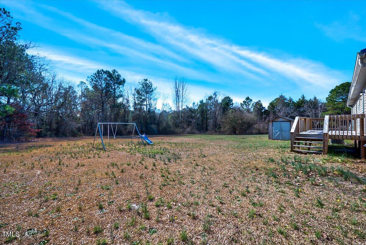 56 Jefferson Lane Cameron, NC 28326 - Photo 34 of 38 a backyard of a house with lots of green space