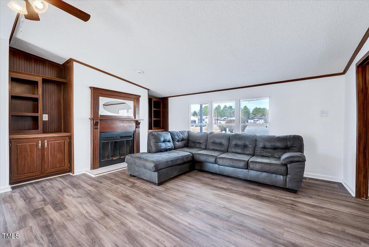 56 Jefferson Lane Cameron, NC 28326 - Photo 5 of 38 a living room with furniture and a flat screen tv