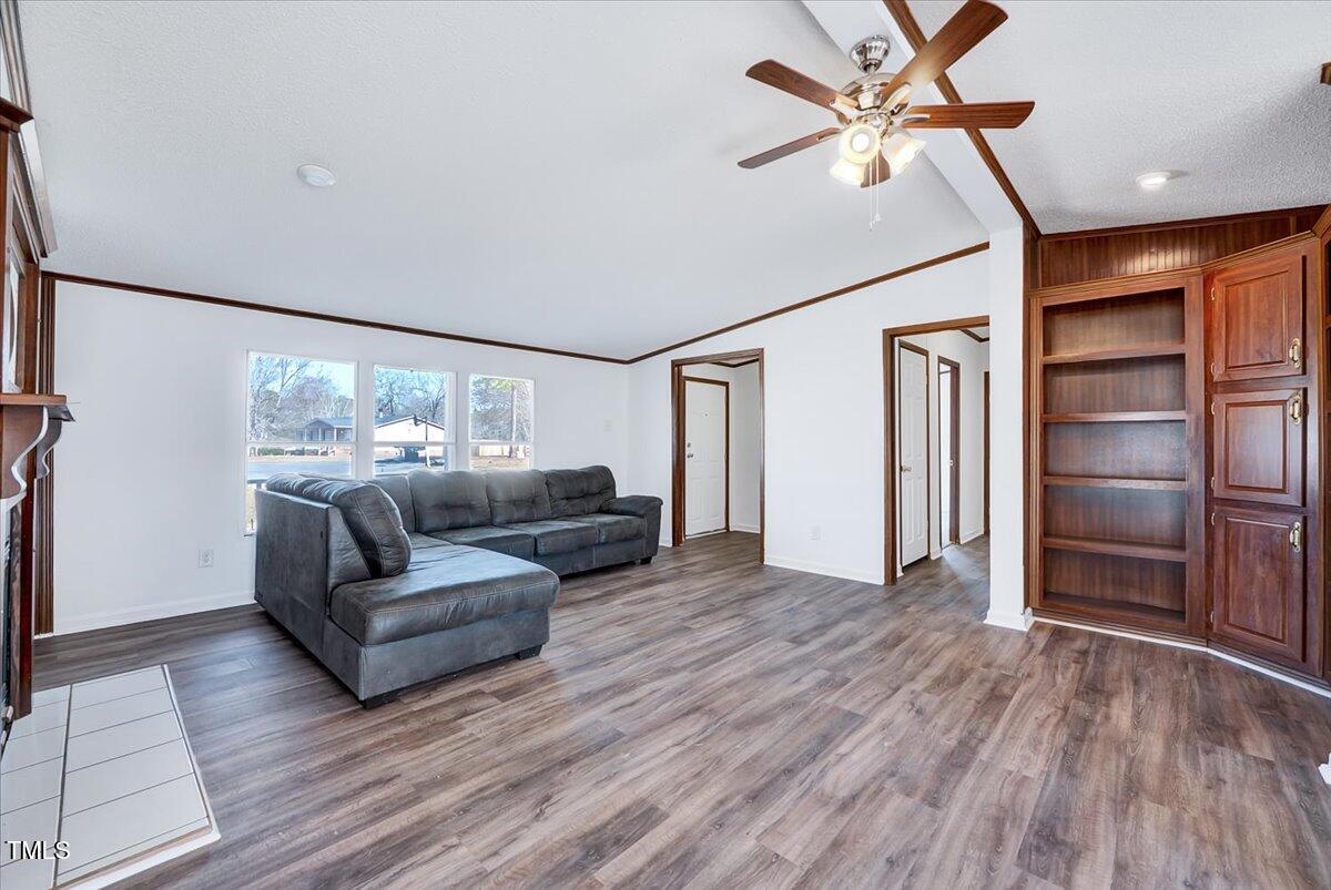 56 Jefferson Lane Cameron, NC 28326 - Photo 6 of 38 a living room with furniture and a ceiling fan