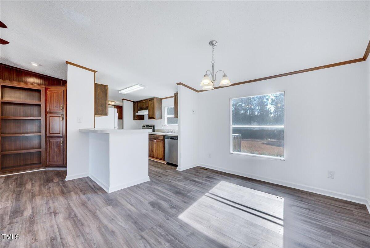 56 Jefferson Lane Cameron, NC 28326 - Photo 8 of 38 a view of an empty room with a window and wooden floor