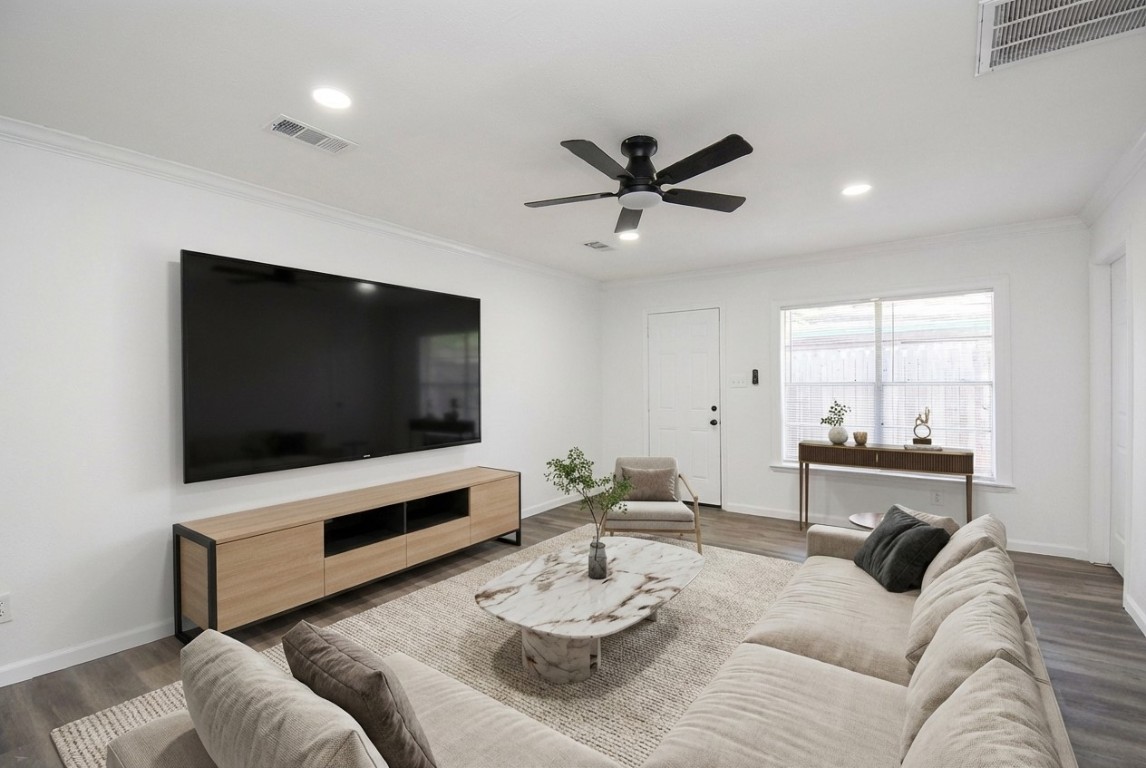 514 Peach Spring Drive Houston, TX 77037 - Photo 12 of 27 a living room with furniture and a flat screen tv