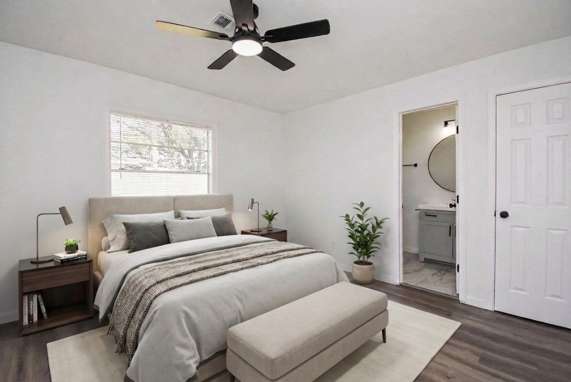 514 Peach Spring Drive Houston, TX 77037 - Photo 14 of 27 a bedroom with a large bed and a chandelier