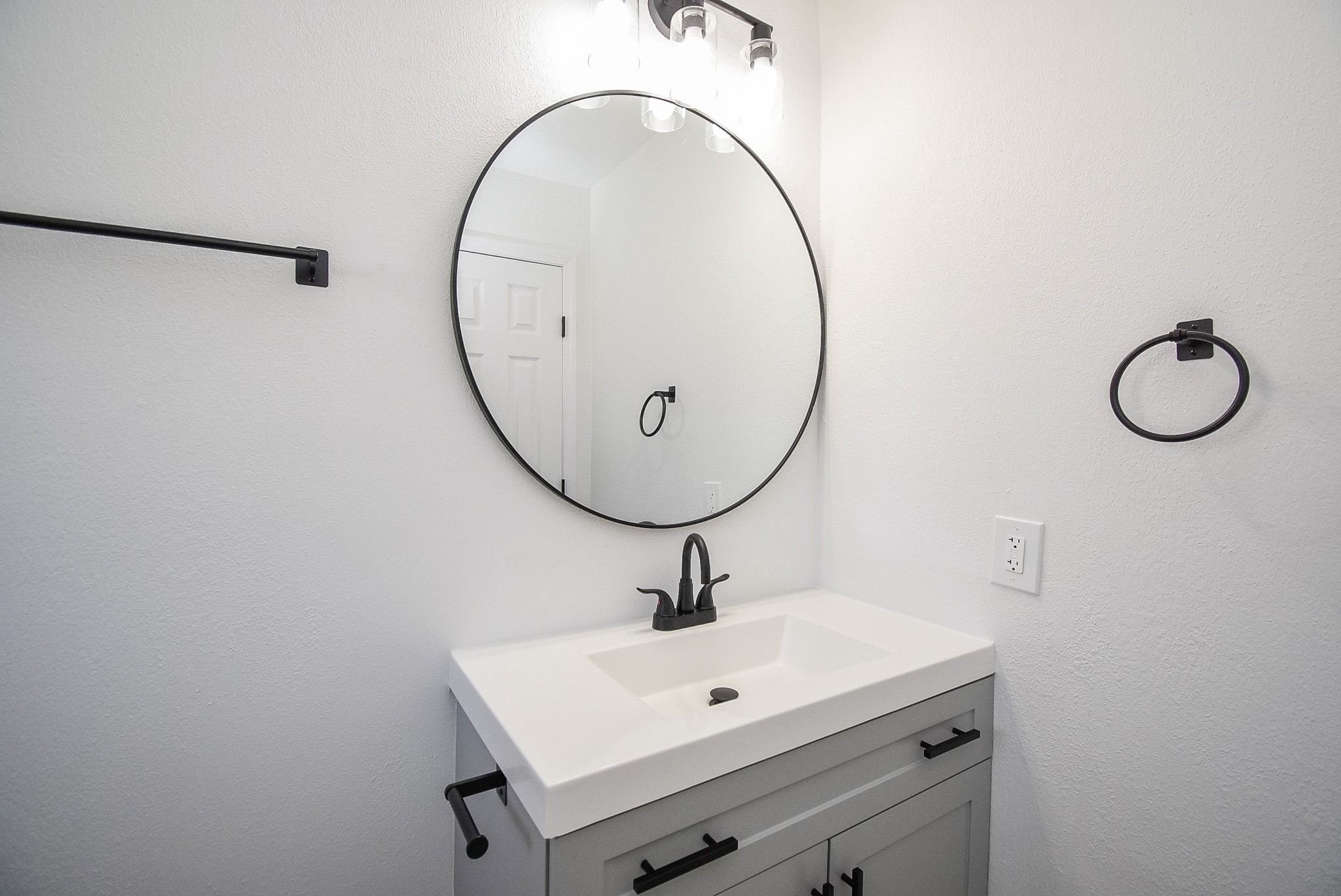 514 Peach Spring Drive Houston, TX 77037 - Photo 17 of 27 a bathroom with a sink and a mirror