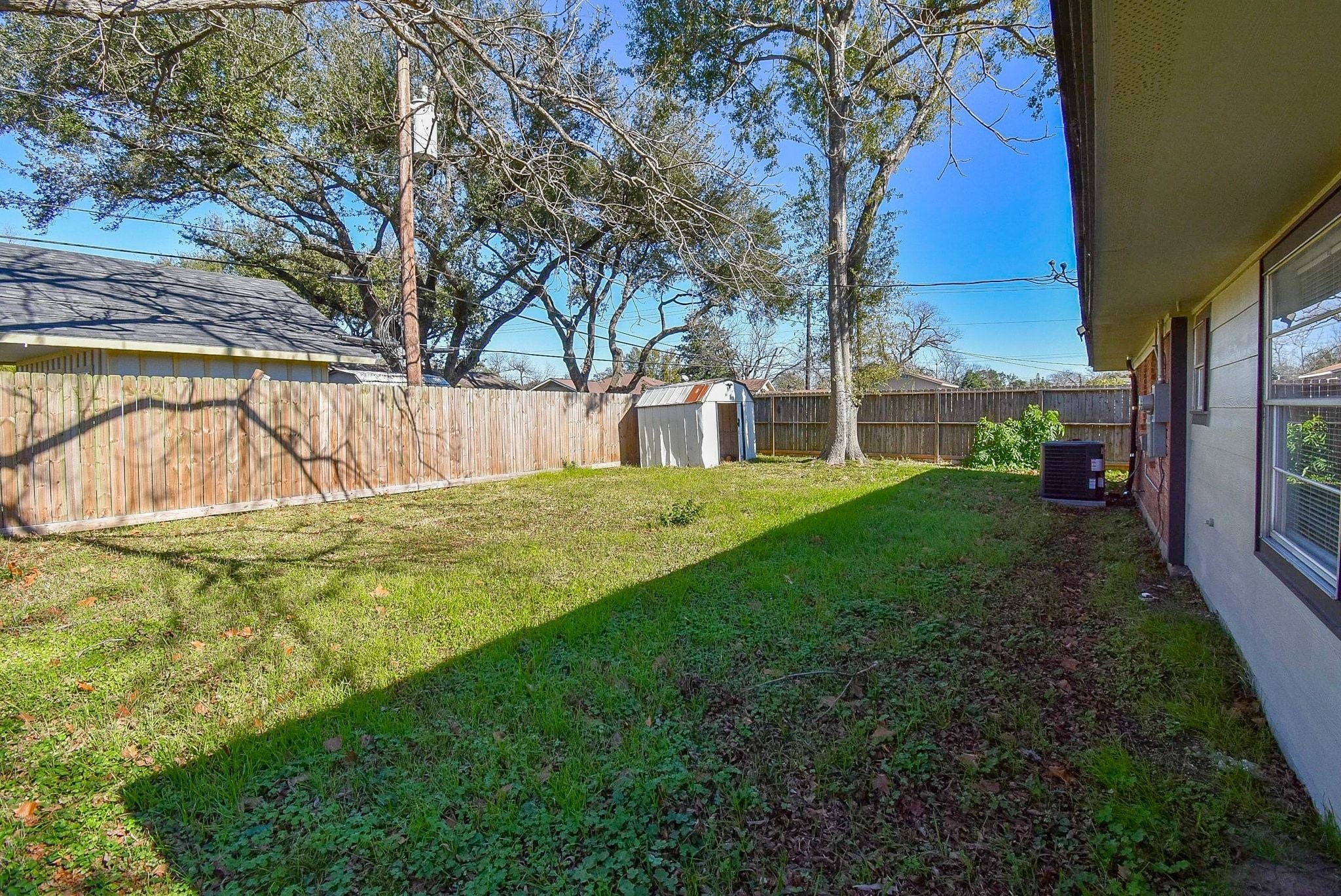 514 Peach Spring Drive Houston, TX 77037 - Photo 25 of 27 a view of backyard with swimming pool