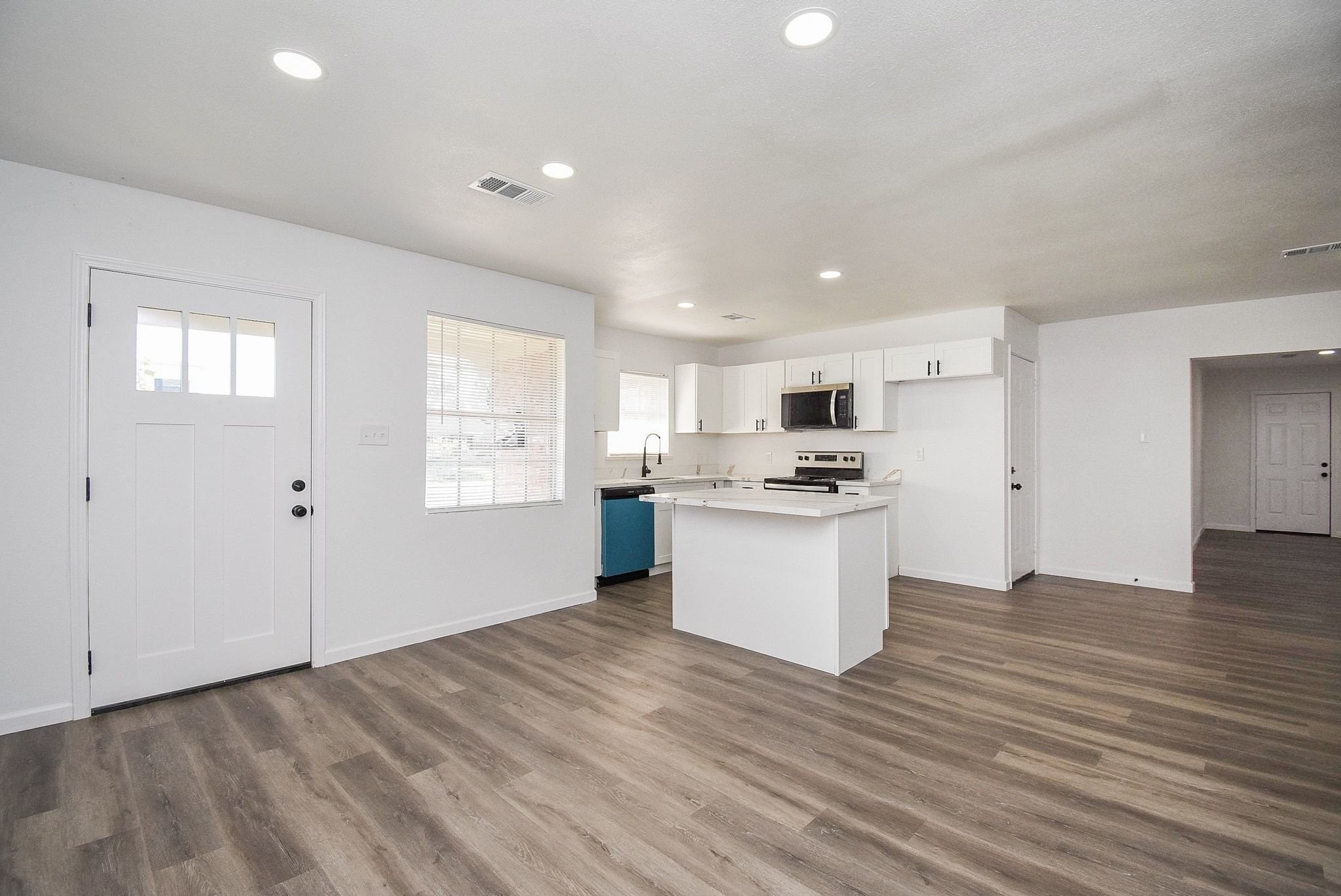 514 Peach Spring Drive Houston, TX 77037 - Photo 4 of 27 a view of kitchen with granite countertop cabinets and white appliances