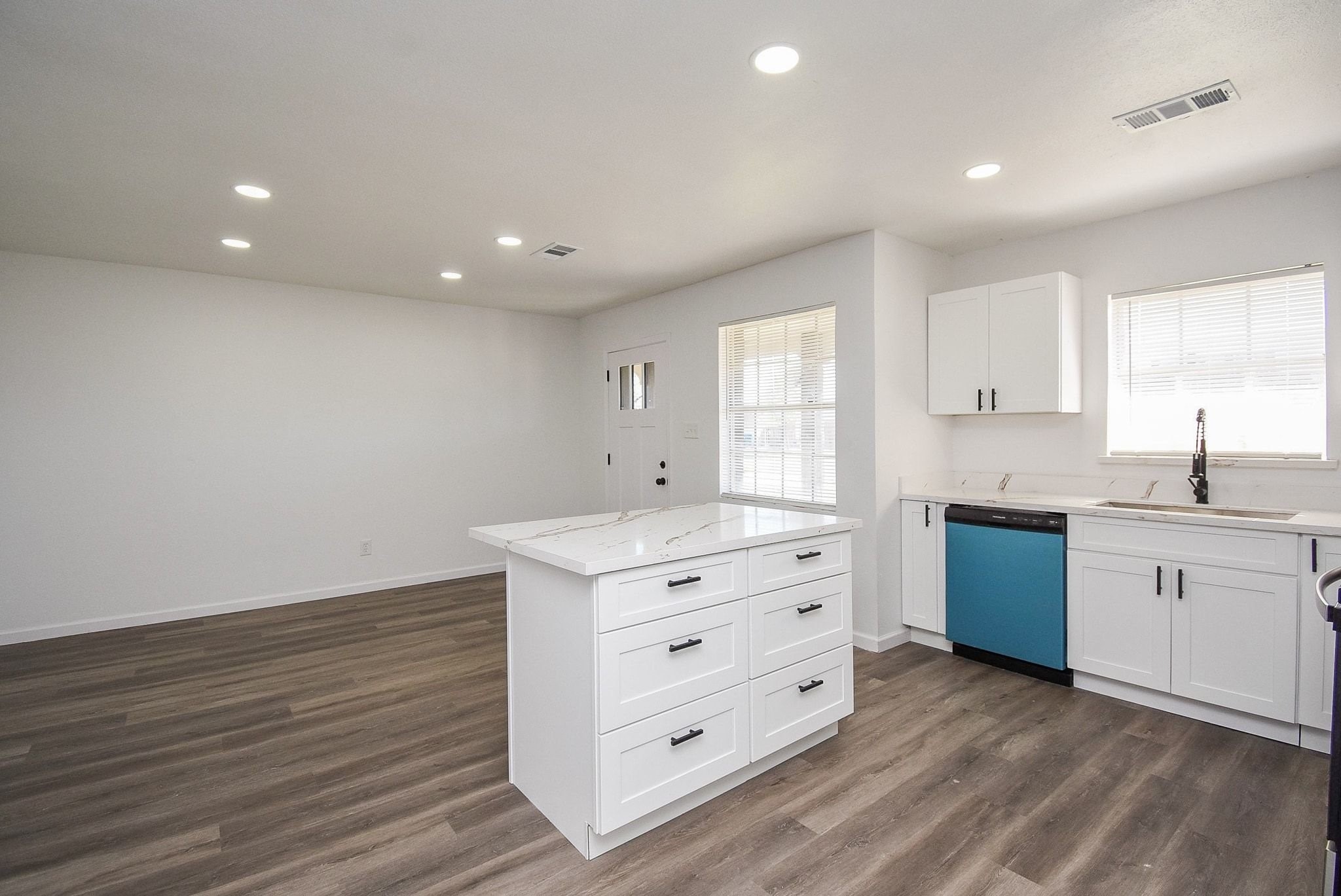 514 Peach Spring Drive Houston, TX 77037 - Photo 8 of 27 a kitchen with granite countertop a white stove top oven and sink