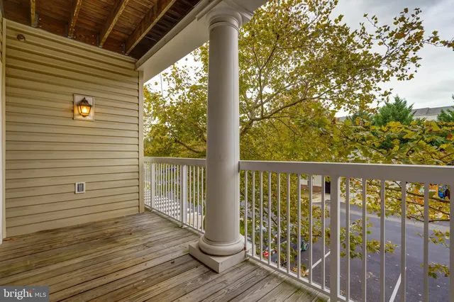 a view of a balcony with wooden floor