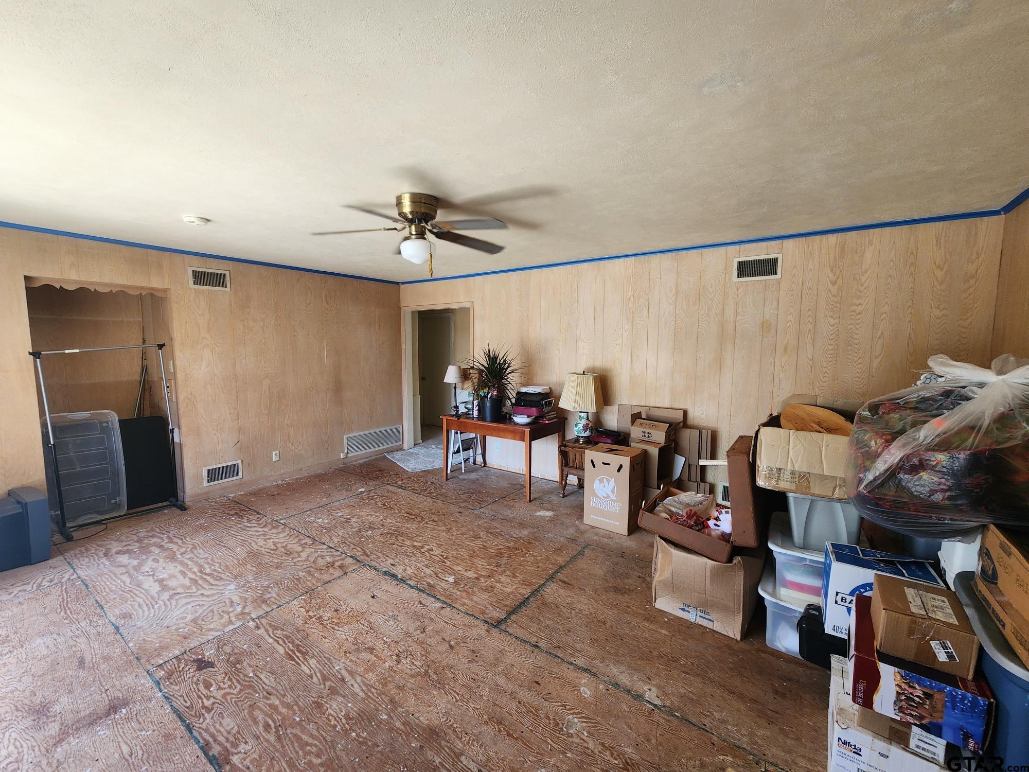 512 E Lane Quitman, TX 75783 - Photo 15 of 32 a living room with furniture and a ceiling fan