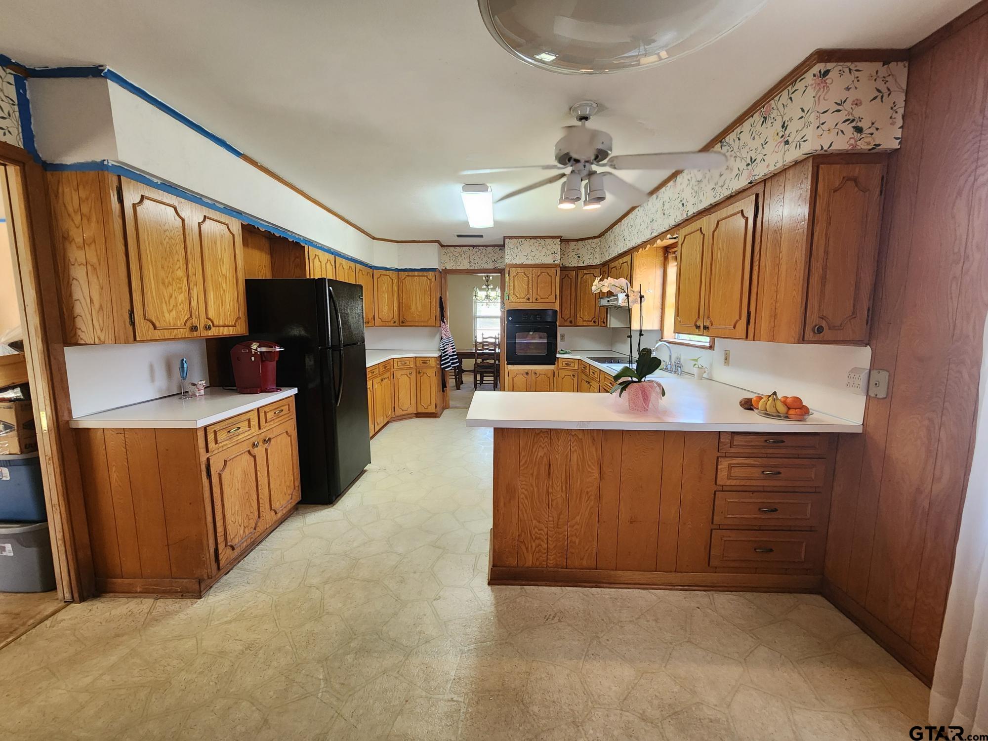 512 E Lane Quitman, TX 75783 - Photo 18 of 32 a kitchen with a sink appliances cabinets and furniture