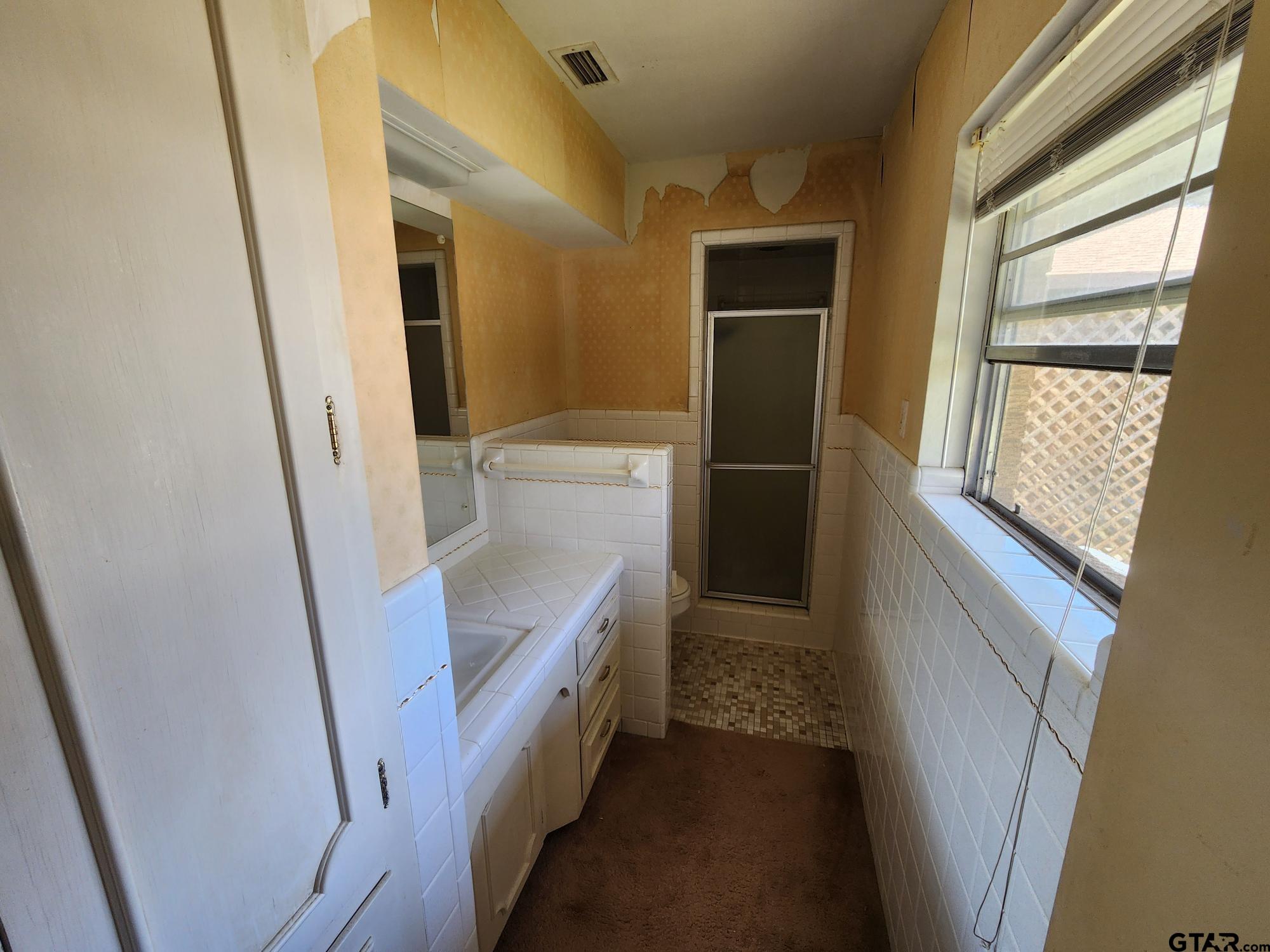 512 E Lane Quitman, TX 75783 - Photo 27 of 32 a view of walk in closet
