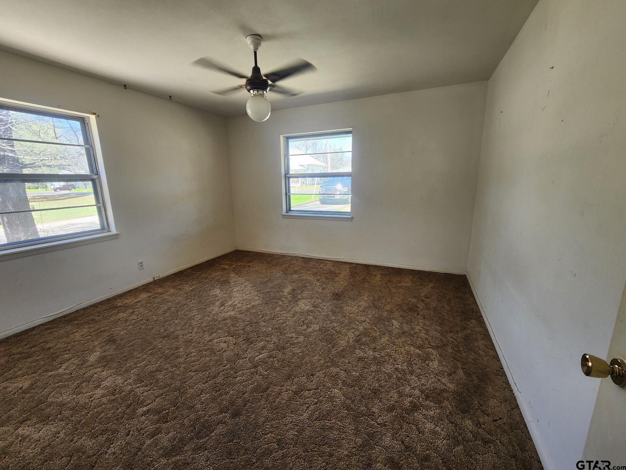 512 E Lane Quitman, TX 75783 - Photo 29 of 32 an empty room with a window