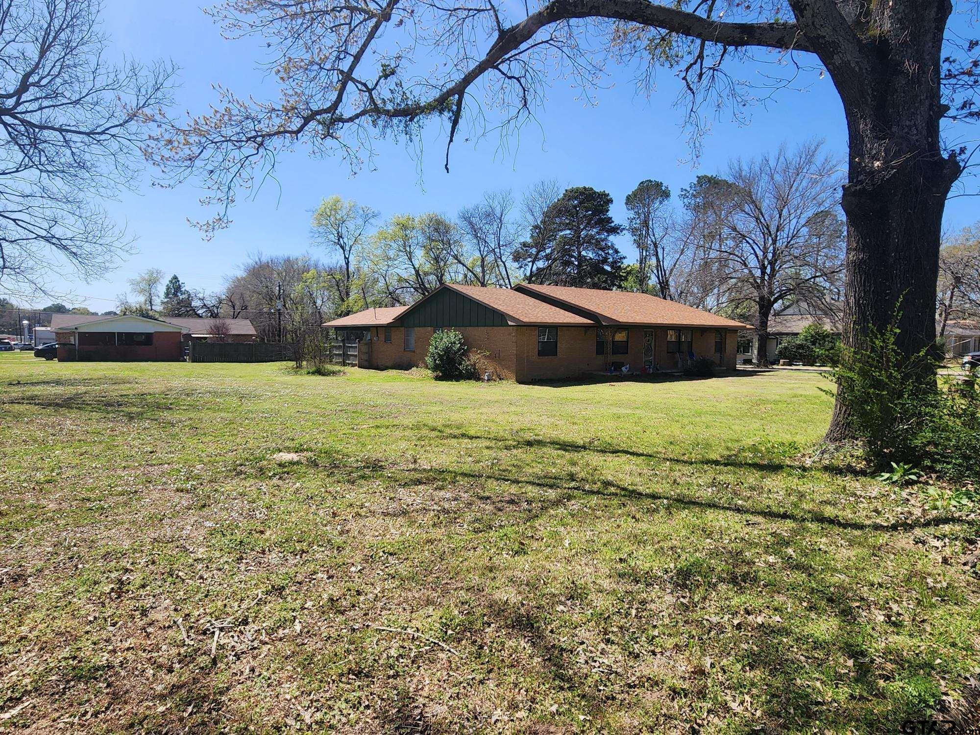 512 E Lane Quitman, TX 75783 - Photo 3 of 32 a view of a yard with a house