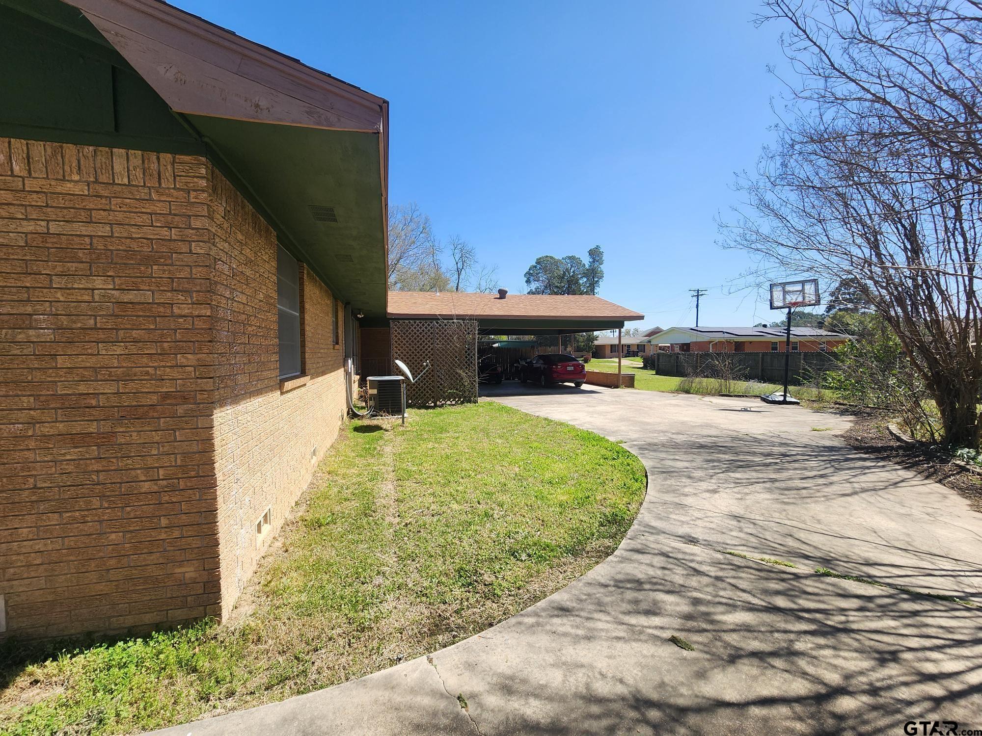 512 E Lane Quitman, TX 75783 - Photo 7 of 32 a view of a backyard with sitting area