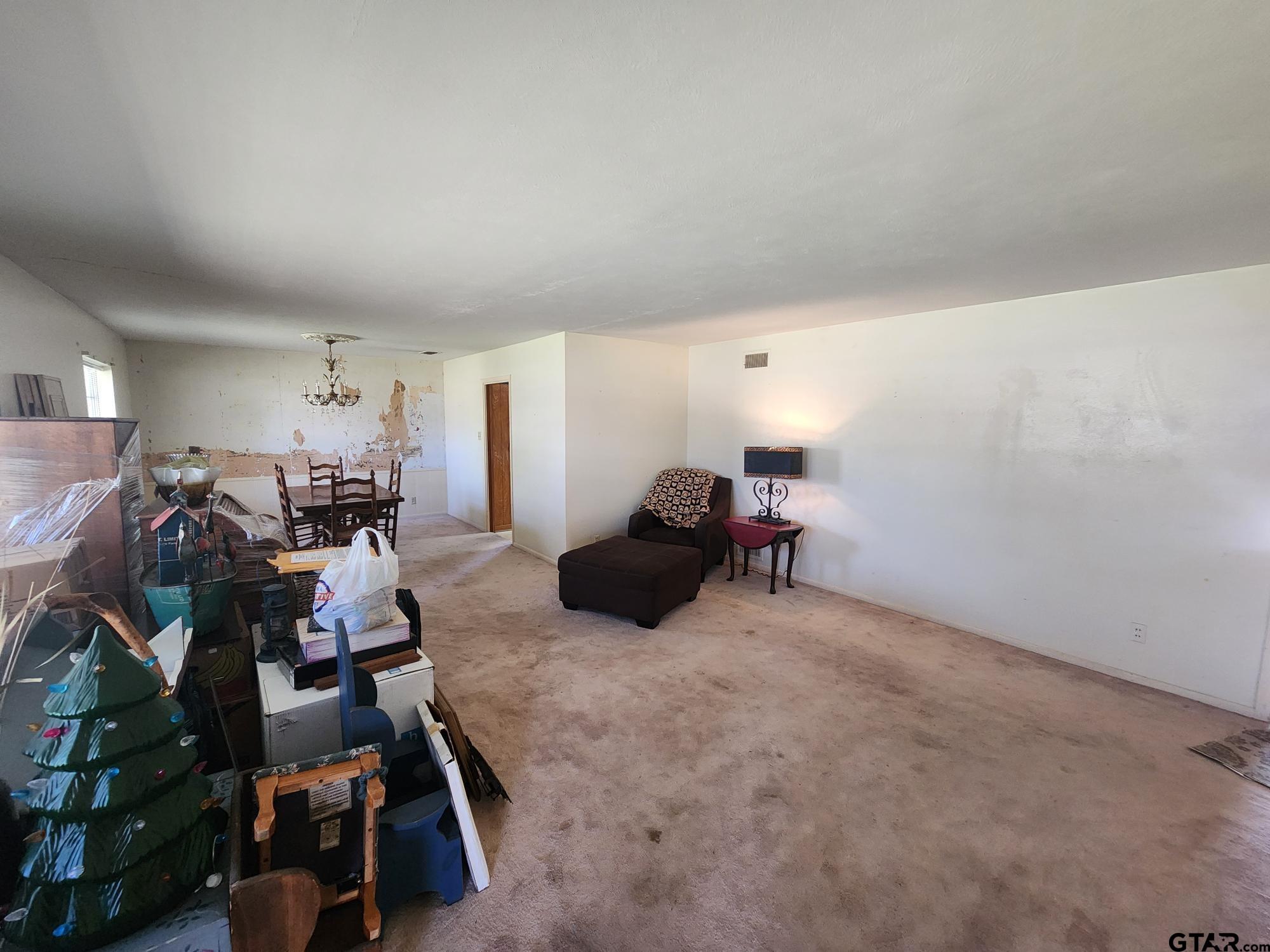 512 E Lane Quitman, TX 75783 - Photo 9 of 32 a room with furniture and a gym