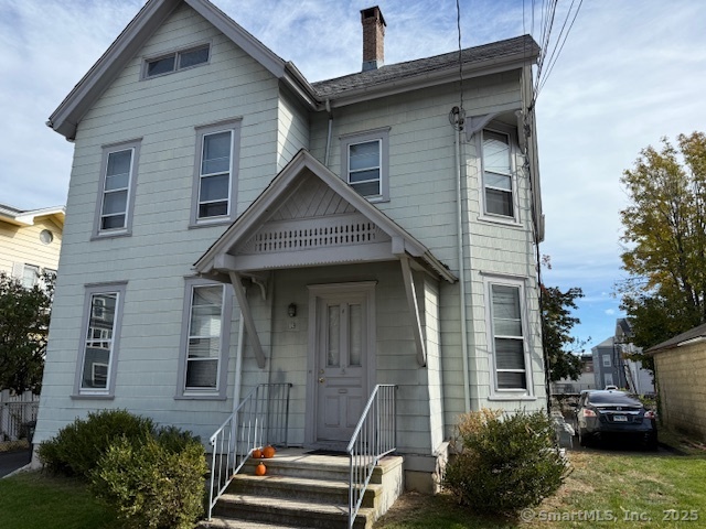 a front view of a house with stairs