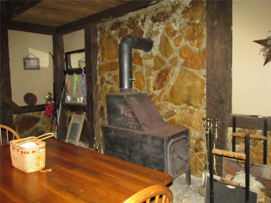 126 Nebo Road Champion, PA 15622 - Photo 4 of 25 Just one of the many heat sources! There's electric baseboard, propane, this wood burner and a pellet stove!
