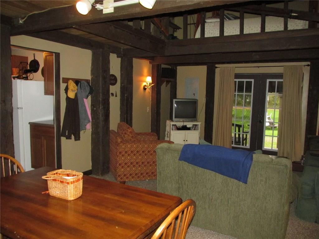 126 Nebo Road Champion, PA 15622 - Photo 5 of 25 Off to the left is the kitchen! You can just get a peek of one side of the loft upstairs.