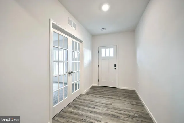 a view of room with hardwood floor