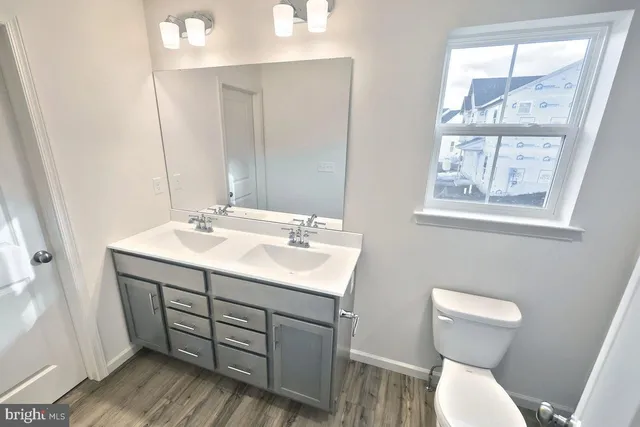 a bathroom with a shower and toilet