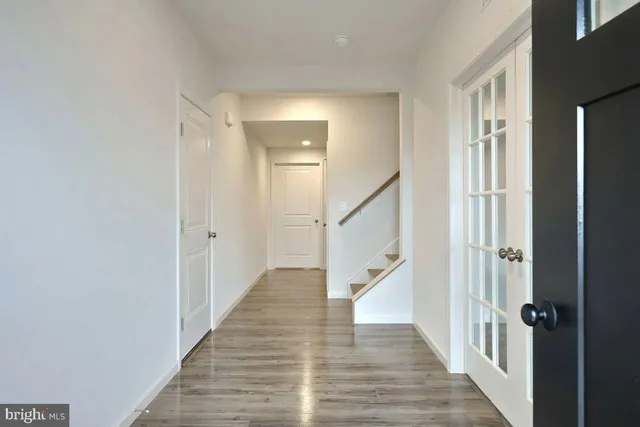 a view of a hallway with the wooden floor