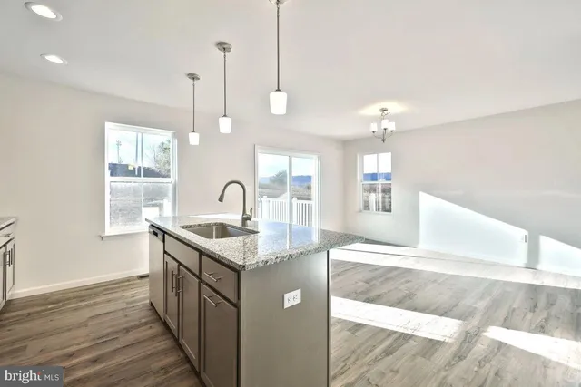 a kitchen with a sink and window