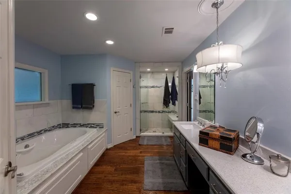 a view of a hallway with a large window with wooden floor