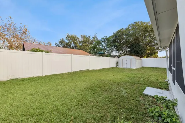 a backyard of a house with lots of green space