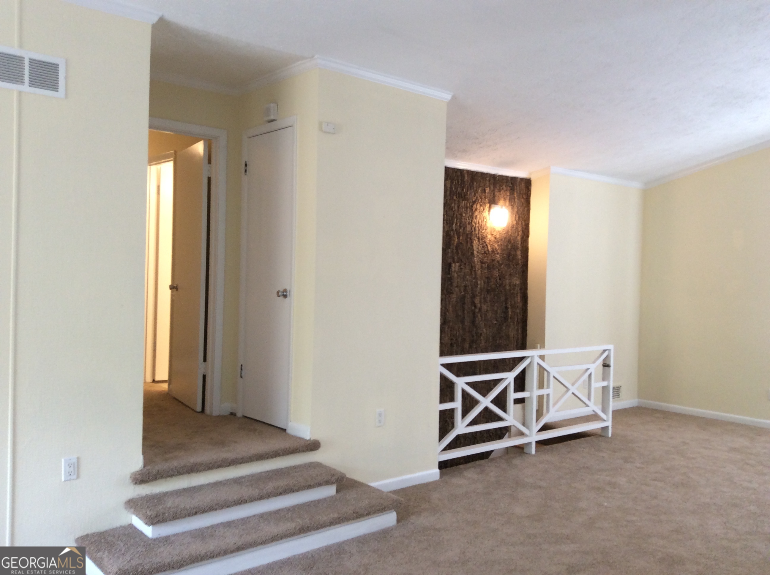 5022 Rock Springs Road Lithonia, GA 30038 - Photo 11 of 35 a view of an empty room with wooden floor