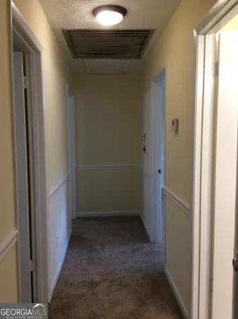 a view of a bathroom from a hallway