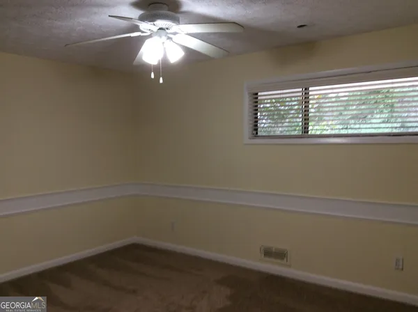 an empty room with a bathroom