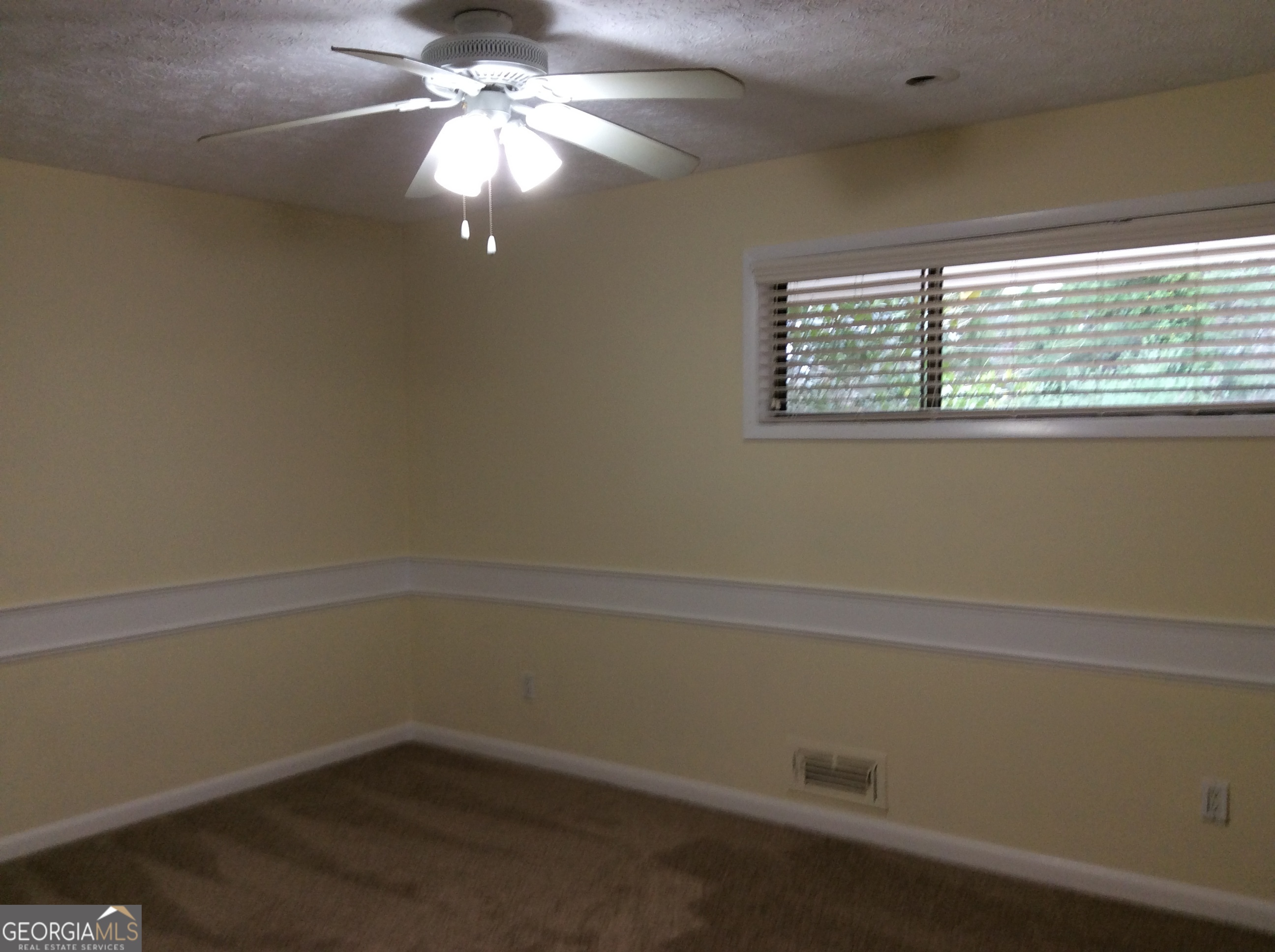 5022 Rock Springs Road Lithonia, GA 30038 - Photo 15 of 35 an empty room with a window