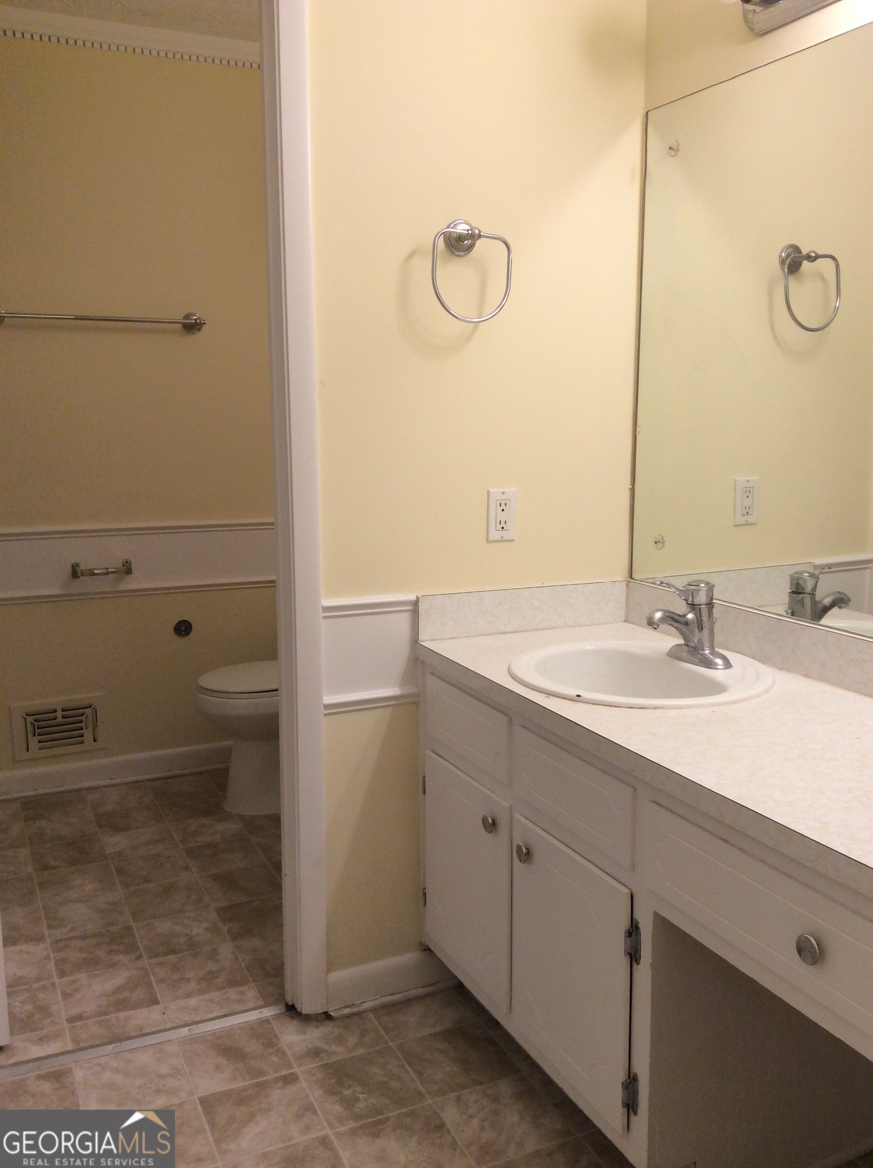 5022 Rock Springs Road Lithonia, GA 30038 - Photo 17 of 35 a bathroom with a sink and a mirror
